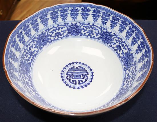 An unusual large Japanese Arita blue and white Kakiemon style bowl, Qianlong mark, 19th century, 30cm, hairline crack